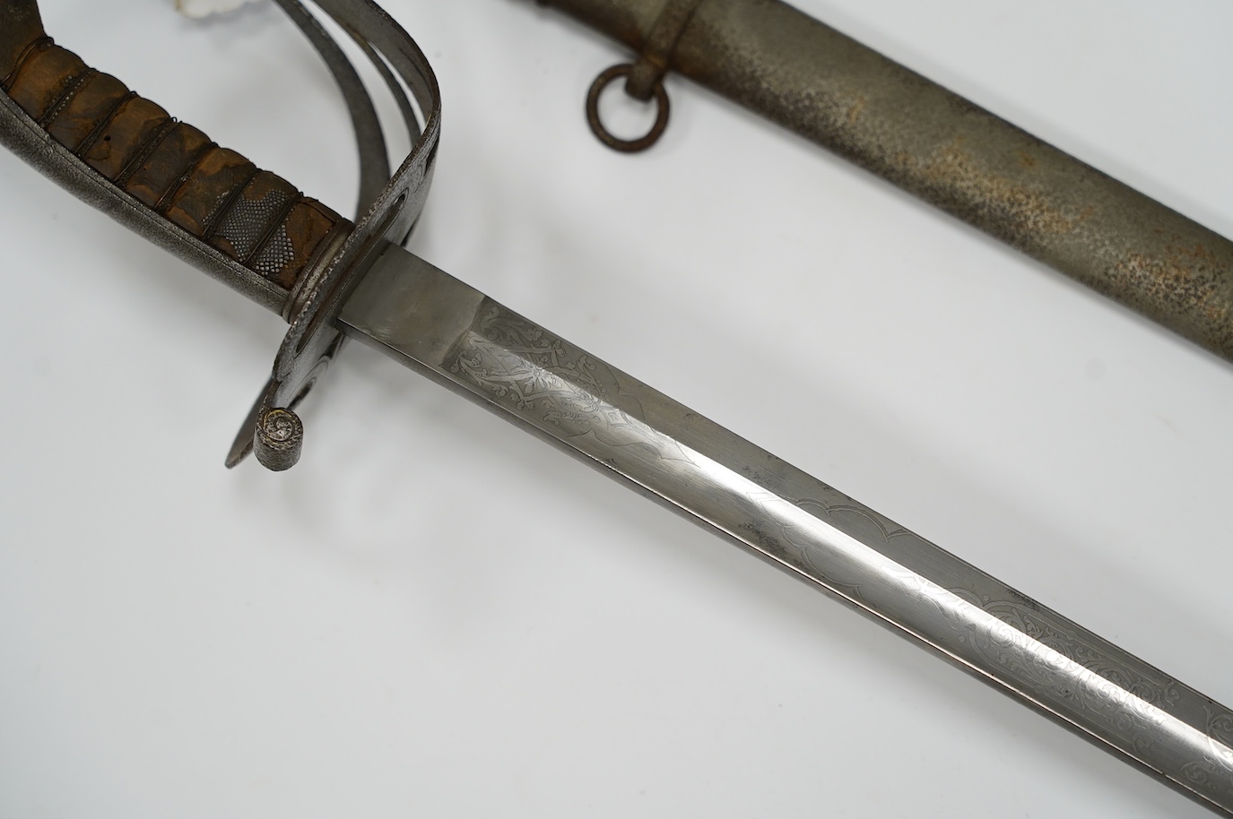 An 1827 pattern Victorian Rifle Officer’s sword, the blade etched with crowned VR and bugle, regulation hilt and scabbard, blade 82.5cm. Condition - poor